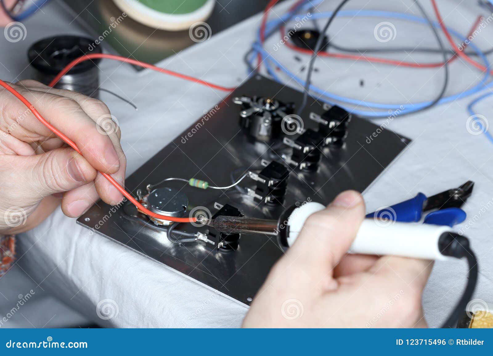 Worker is Soldering a Red Wire Stock Photo Image of laboratory