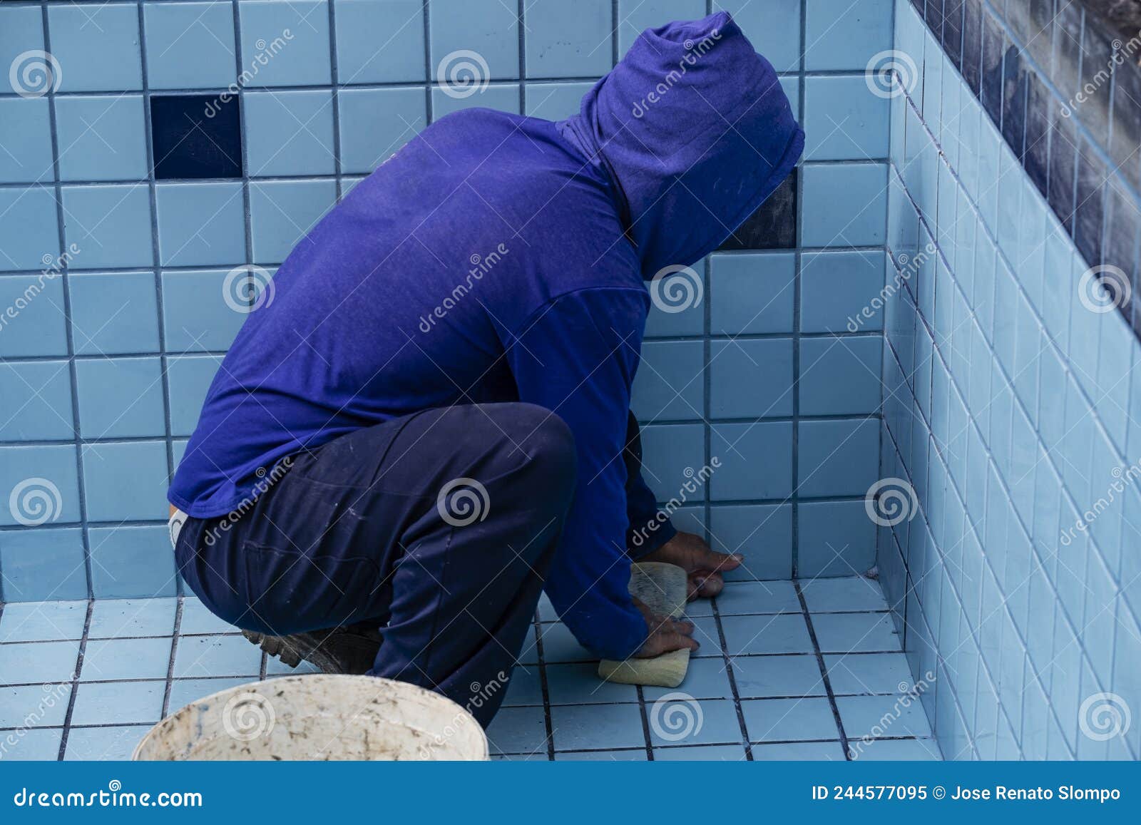 Worker with Sponge Cleaning Pool To Apply Grout between Tiles Stock Image Image of blue