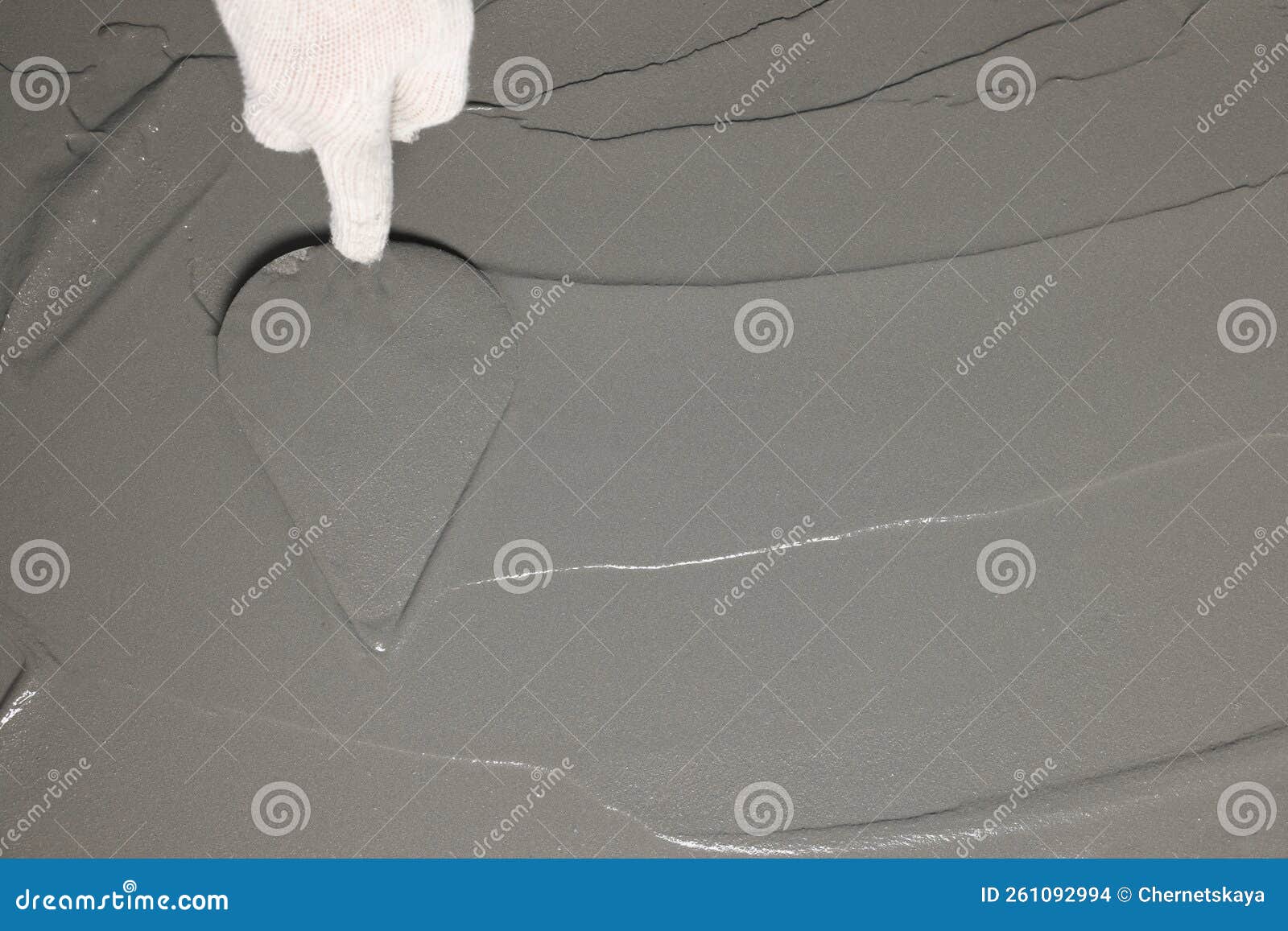 Worker Spreading Wet Concrete with Trowel, Closeup. Space for Text