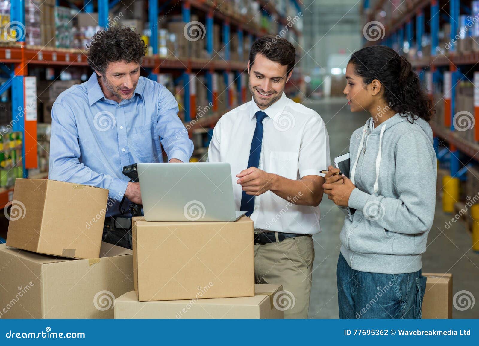 worker-team-looking-laptop-put-cardboard