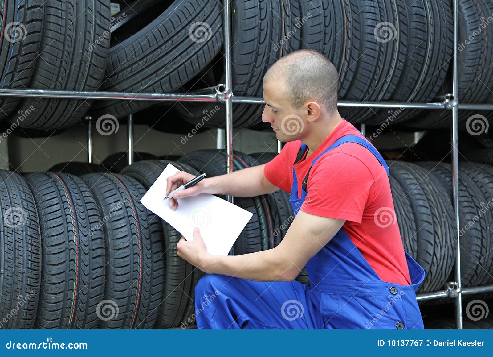 Worker in a tire stock image. Image of mechanic 10137767