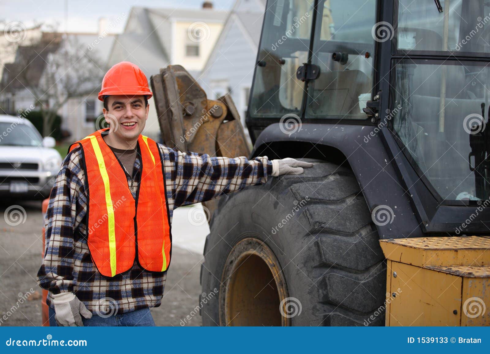 Worker by tractor stock image. Image of construction, improvement 1539133