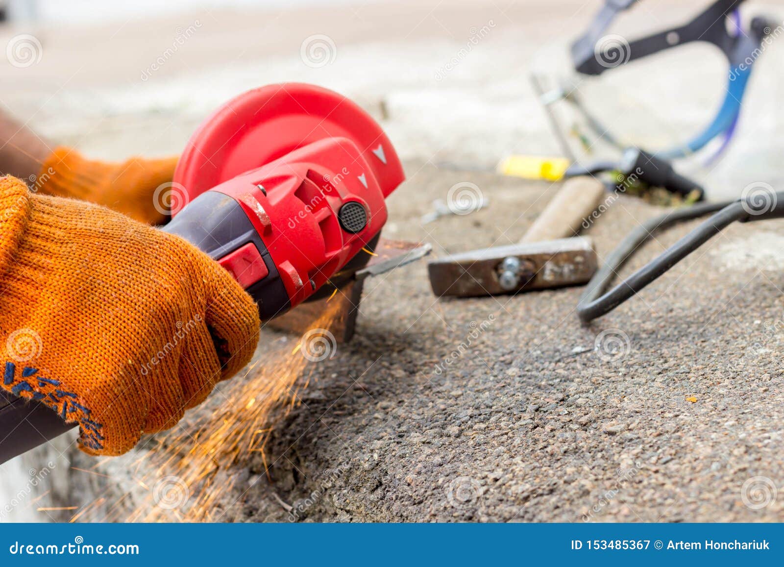 The Worker Uses an Angle Drive Grinder To Work with a Metal Corner