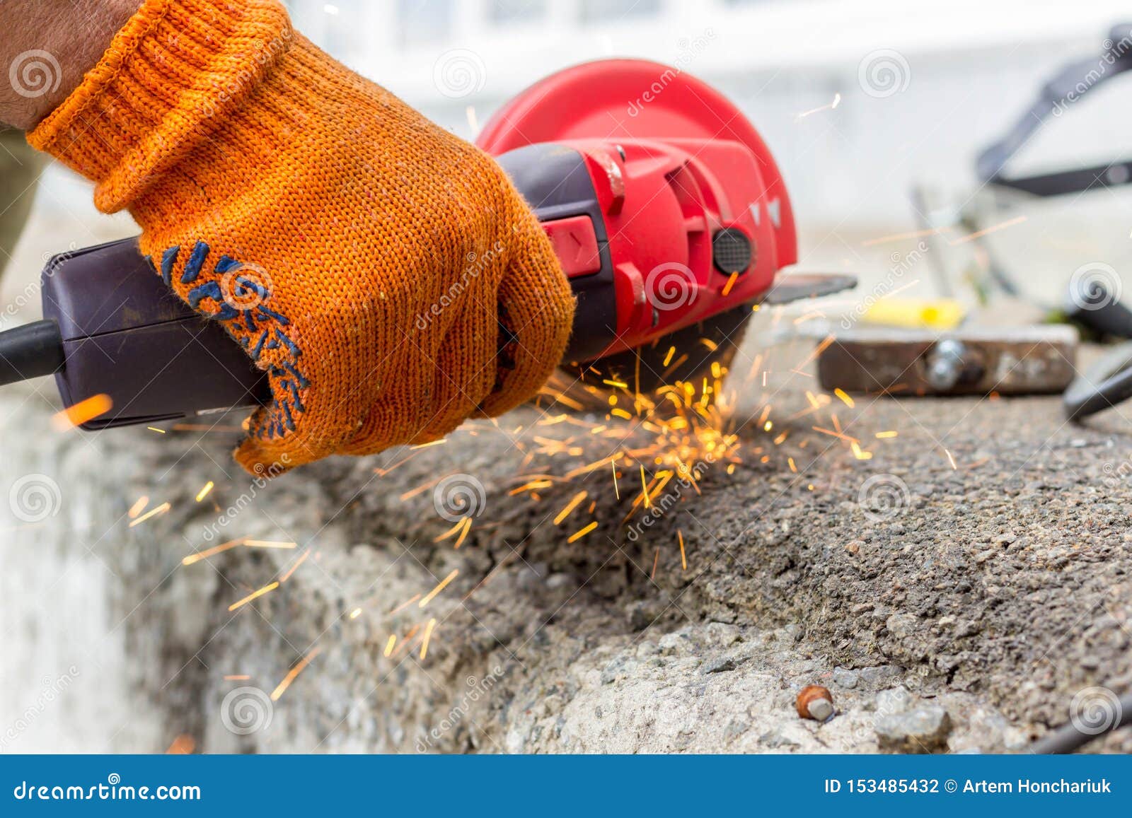 The Worker Uses an Angle Drive Grinder To Work with a Metal Corner