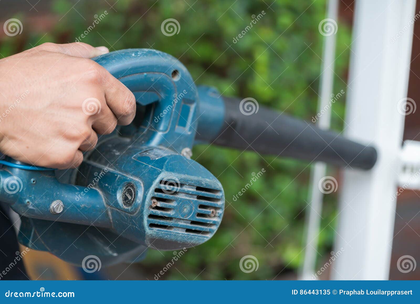 Worker Uses a Handheld Blower To Remove Dust Stock Image Image of