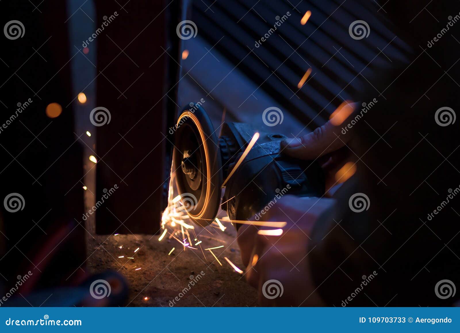 Worker Using Angle Grinder on Garage Door Stock Image Image of