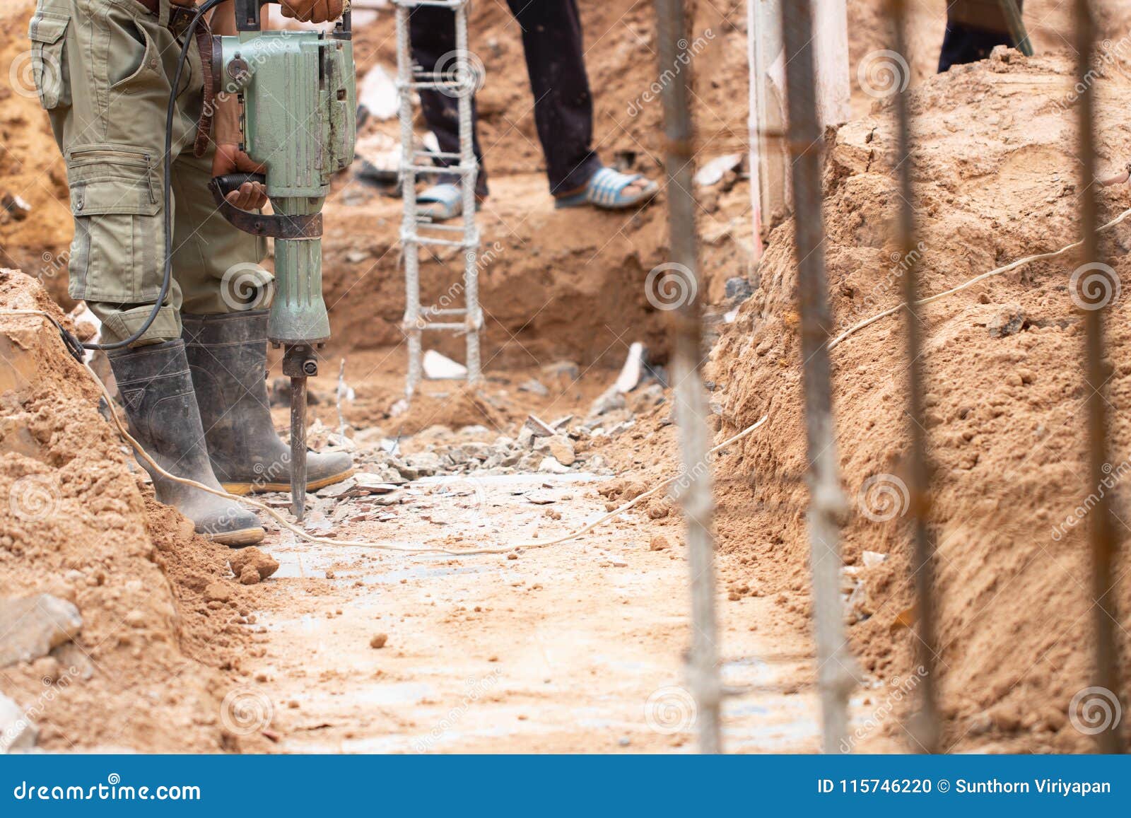 Worker Using Concrete Extractor Machine To Destroy Concrete Stock Photo