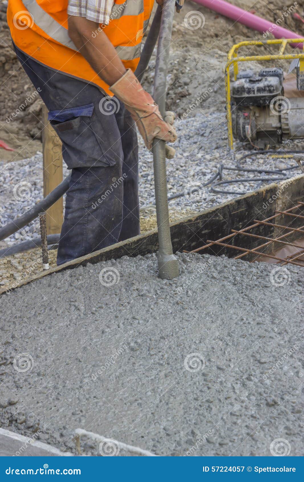 worker using concrete vibrator 2