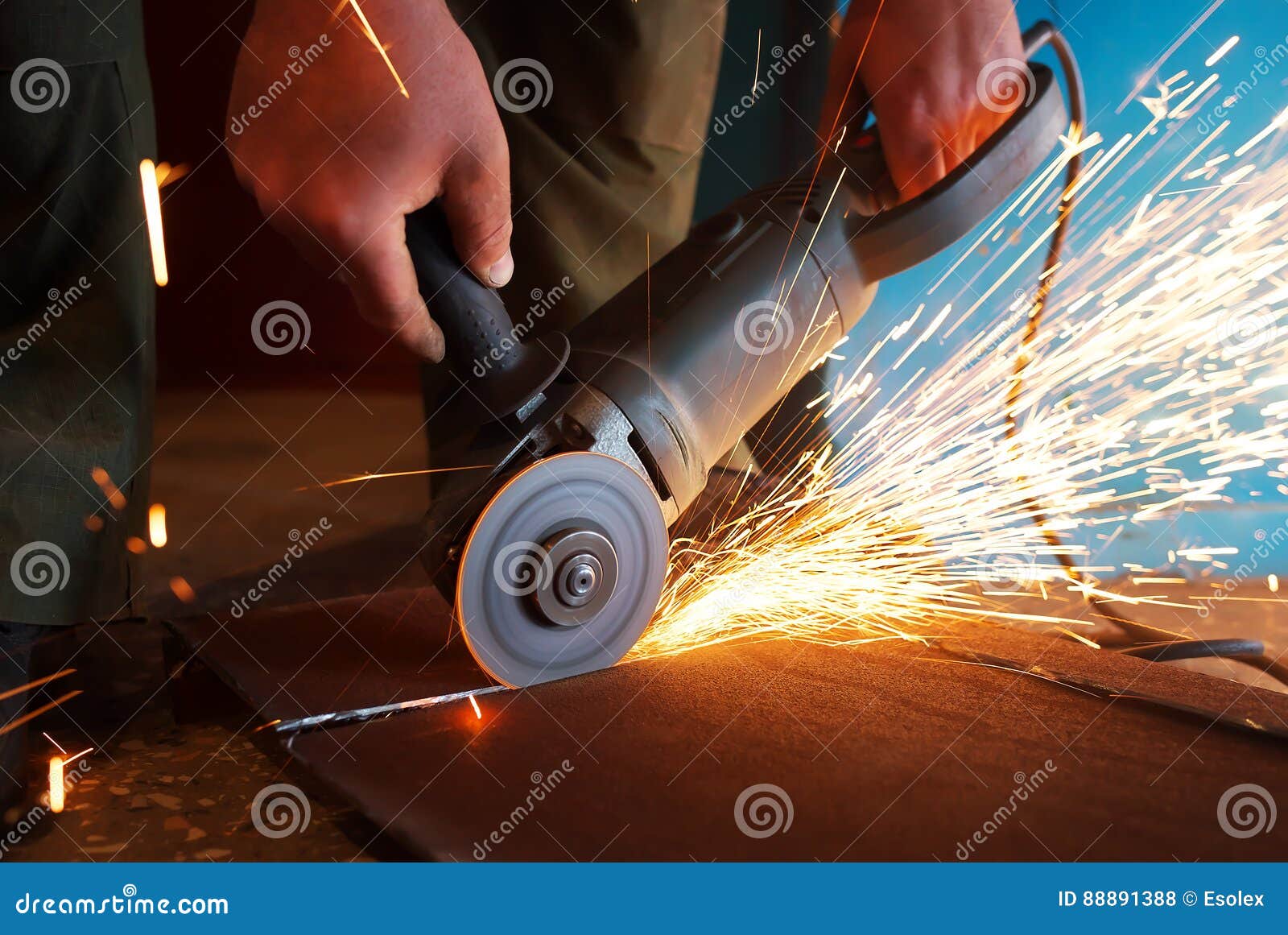 A Worker Using Grinder Cut Metal. Stock Photo Image of mechanical