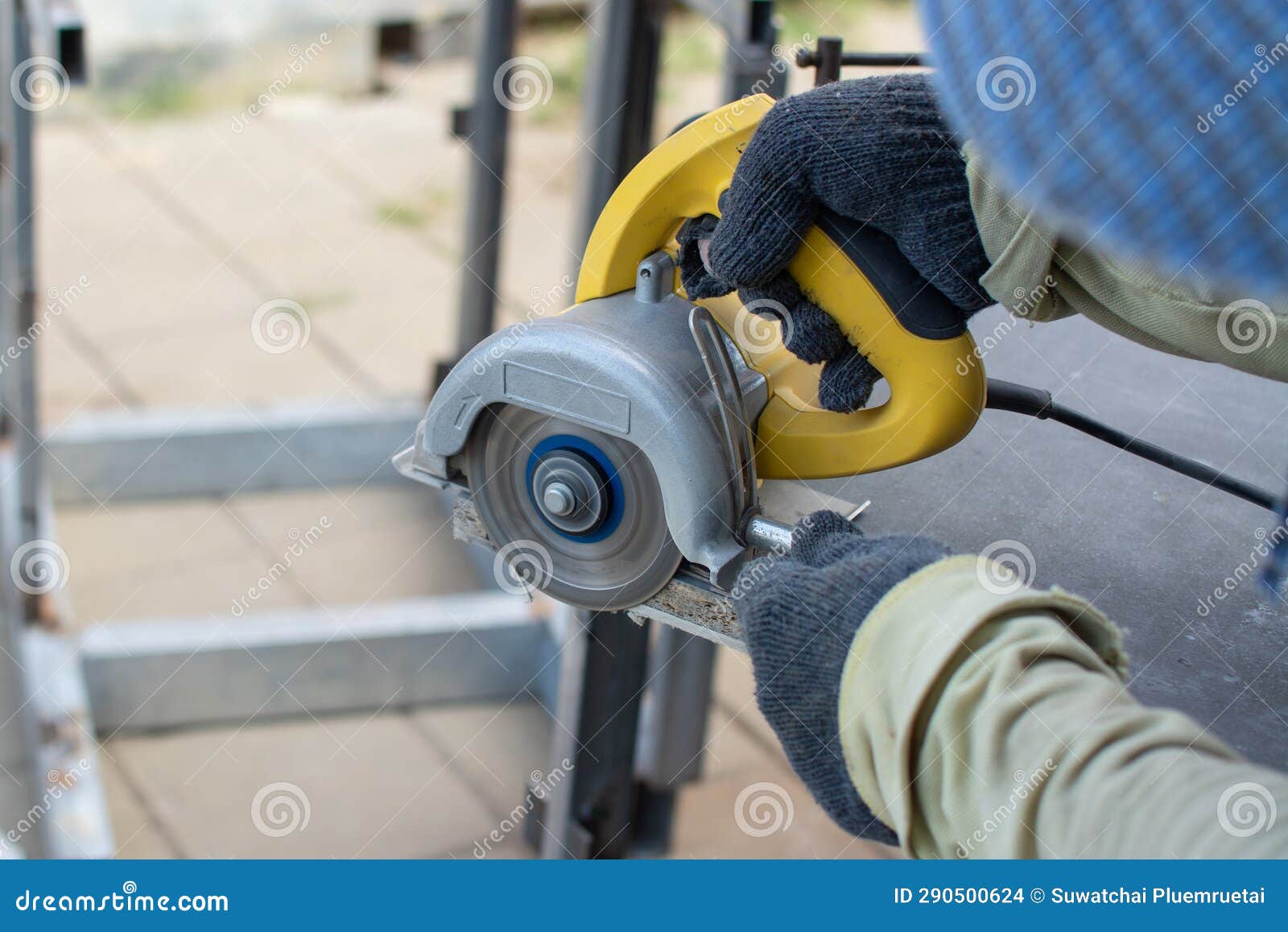 Worker Using a Grinding Machine for Cut Cement Board Stock Photo