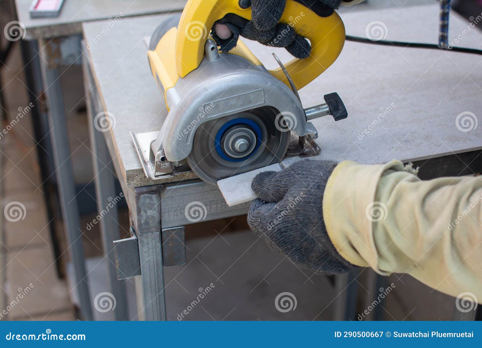 Worker Using a Grinding Machine for Cut Cement Board Stock Image