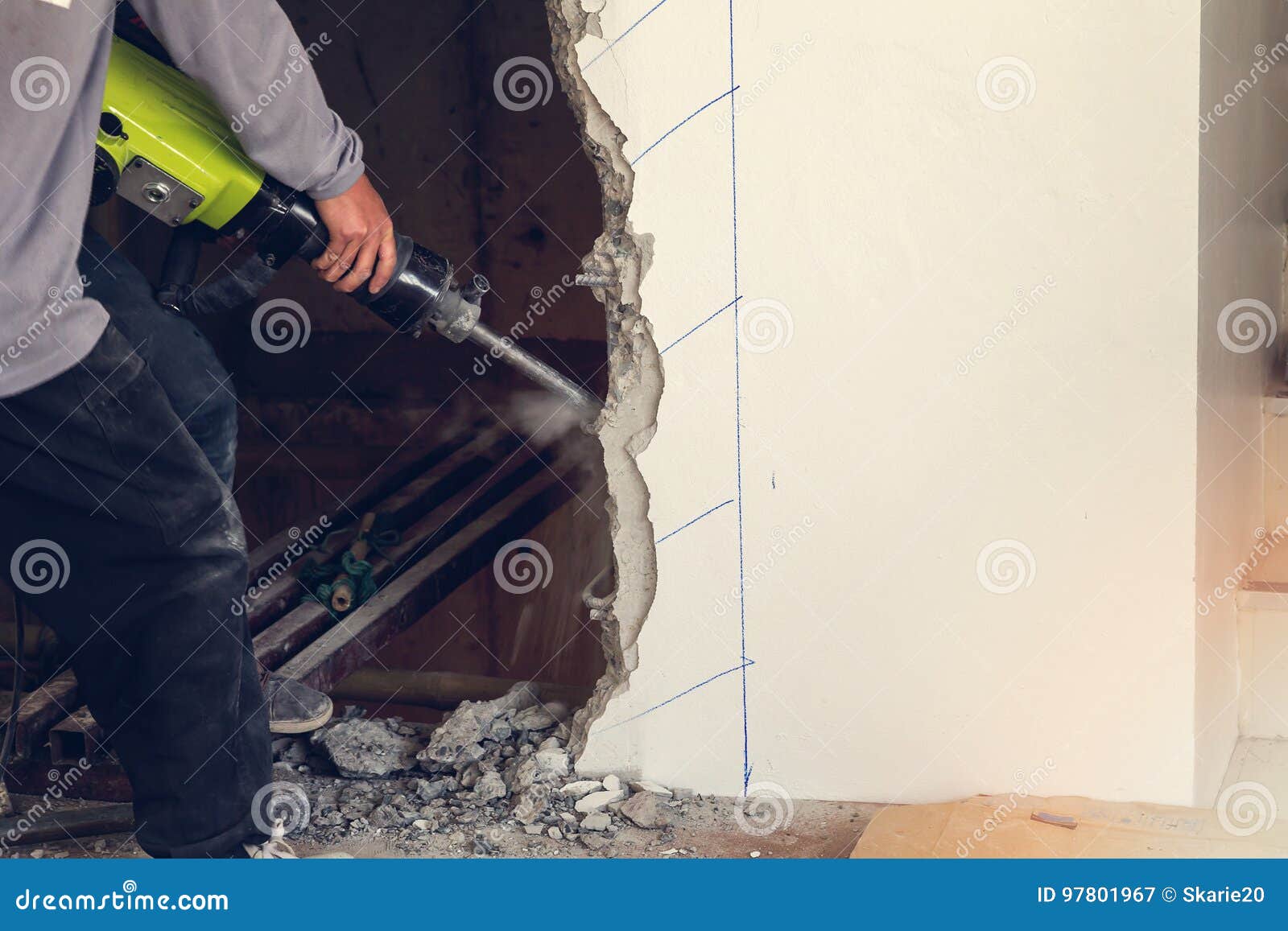 Worker Using a Jackhammer To Drill into Wall Stock Image Image of