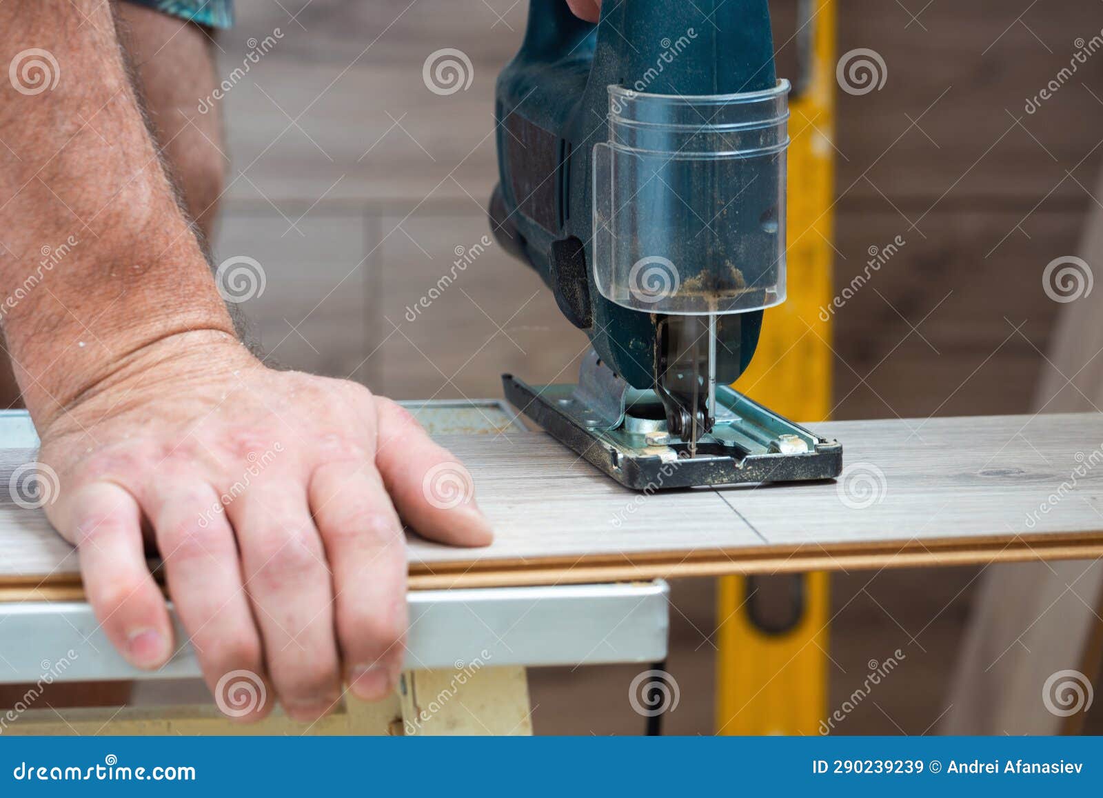 A Worker Using a Jigsaw Saws Laminate Boards Stock Image Image of