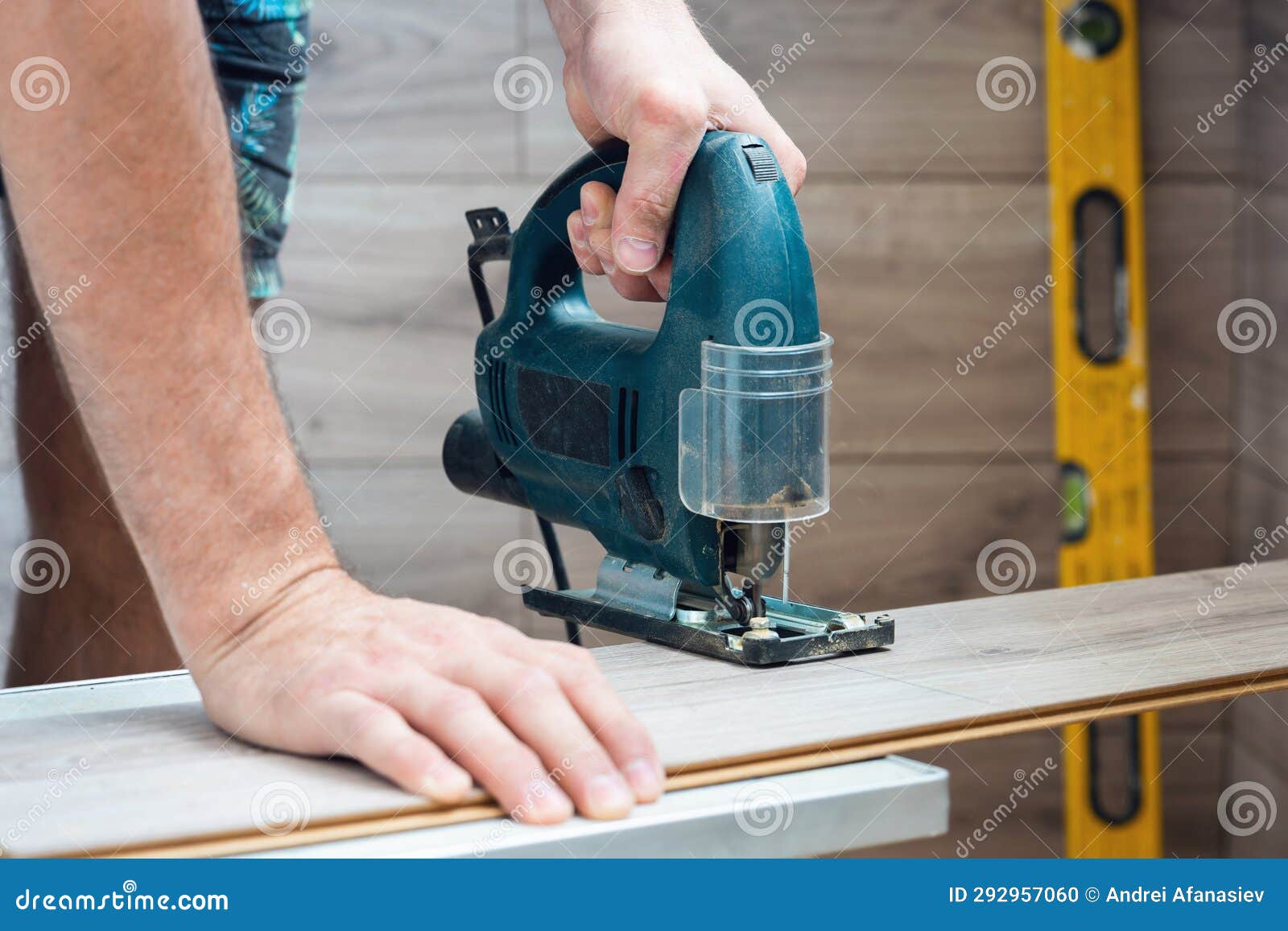 A Worker Using a Jigsaw Saws Laminate Boards Stock Photo Image of