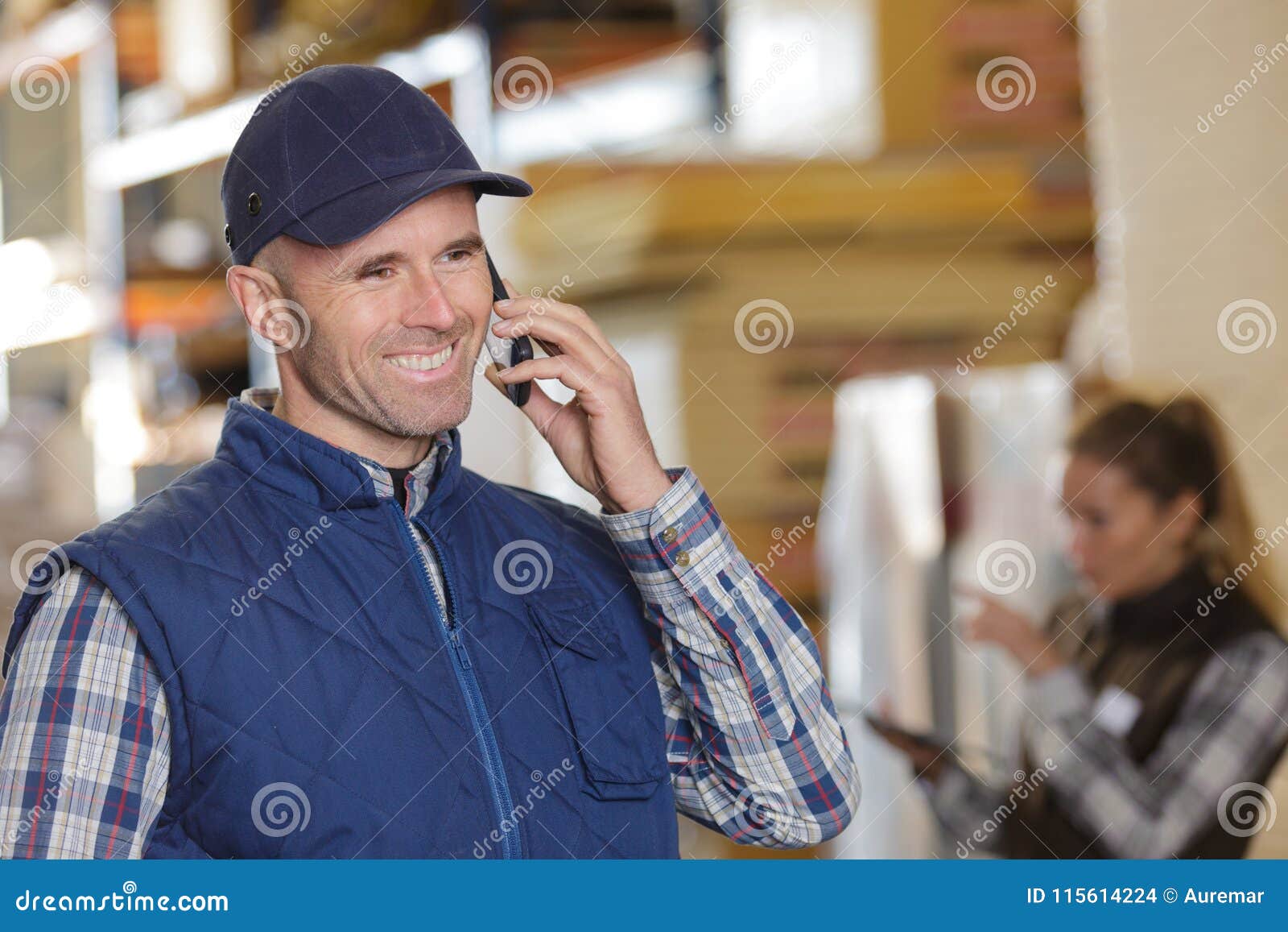 Worker Using Mobile Phone in Warehouse Stock Photo Image of male
