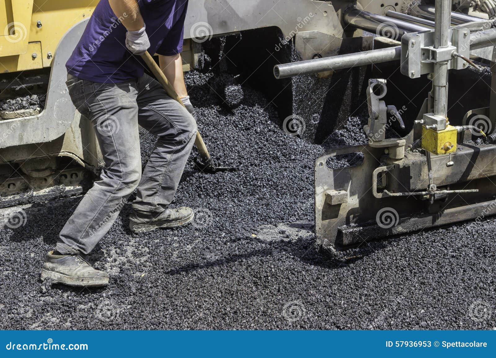worker using shovel and spread asphalt to ensure maximum coverag