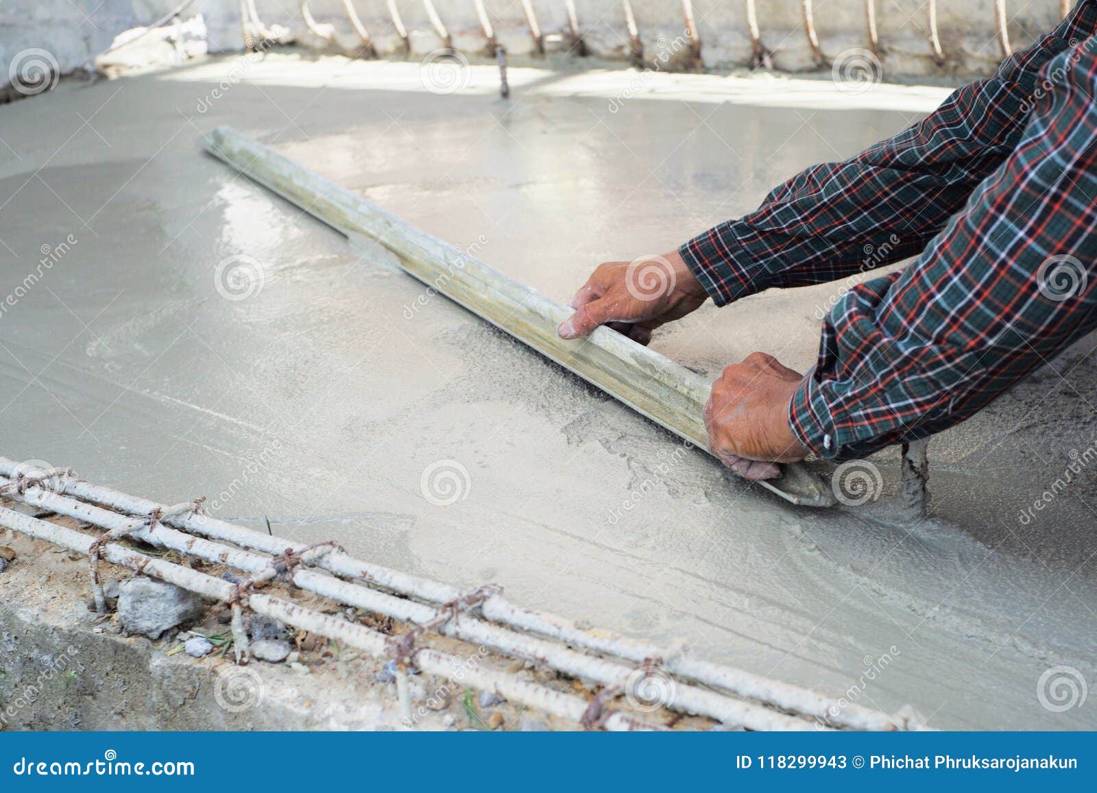 Worker Using Trowel For Level The Reinforcement Of Concrete Floor