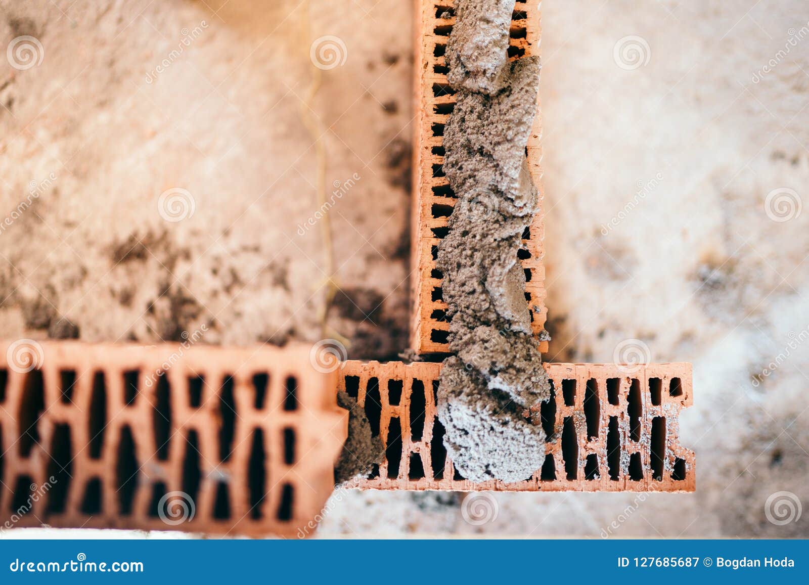 Worker Using Trowel and Tools for Building Exterior Walls with Bricks