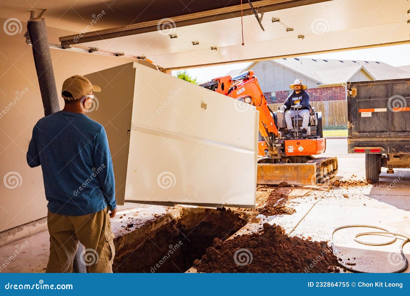 Worker Was Working on a Garage Underground Storm Shelter Installation