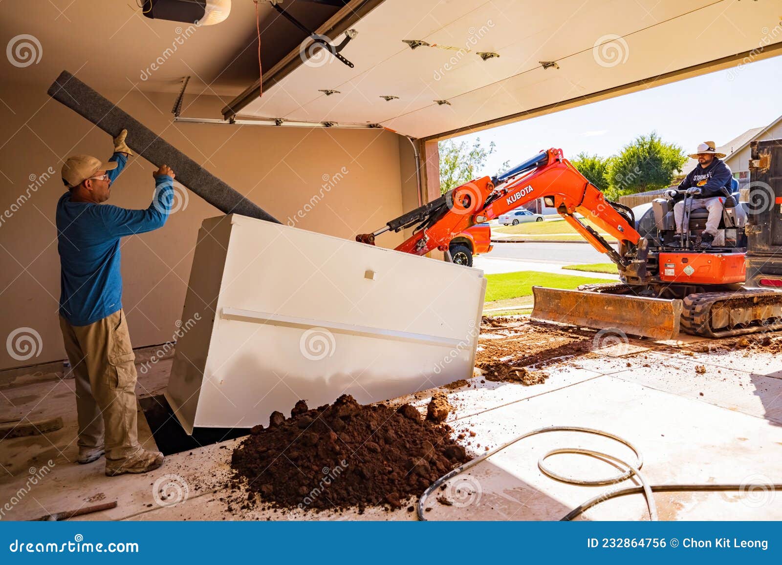 Worker Was Working on a Garage Underground Storm Shelter Installation