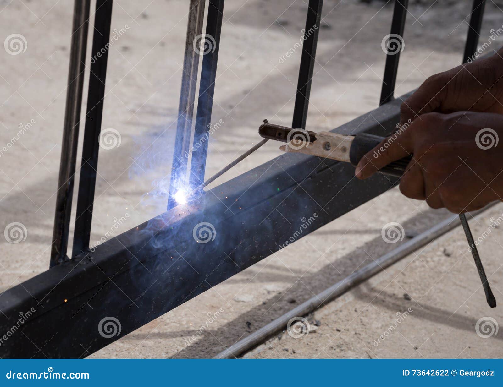 Worker welding door frames stock photo. Image of repair 73642622