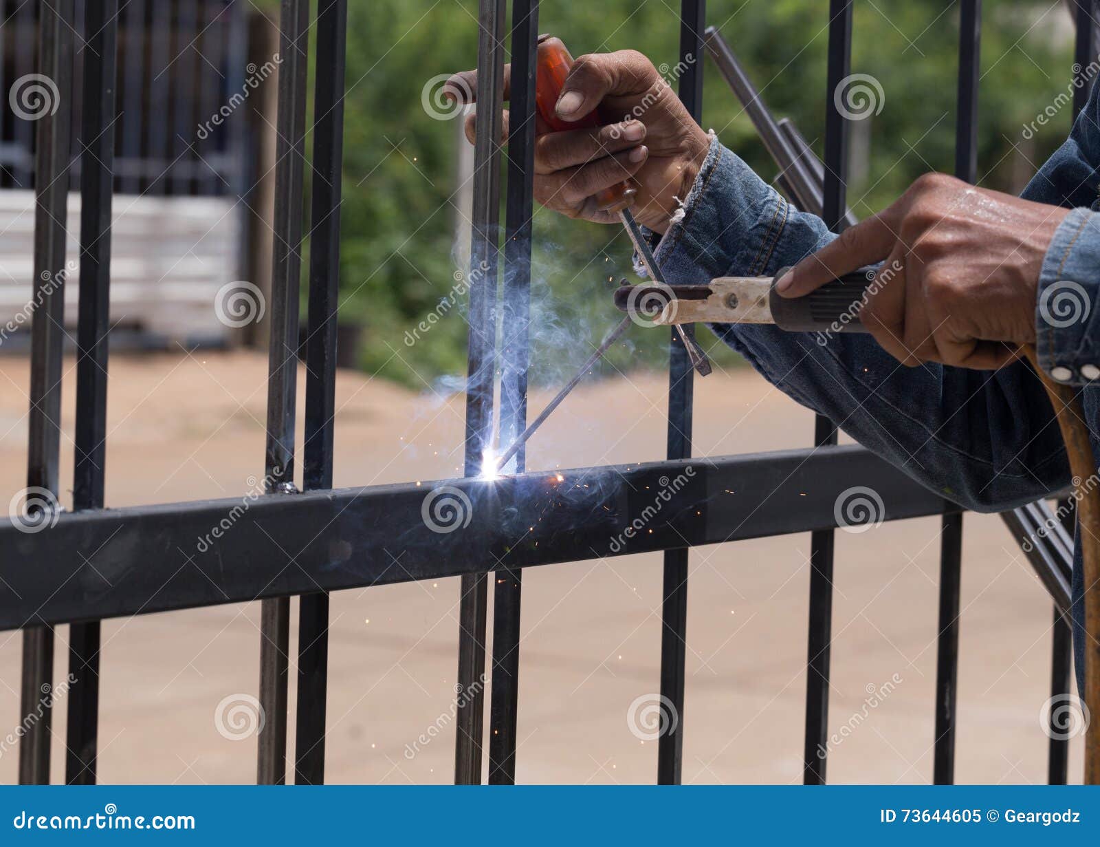 Worker welding door frames stock image. Image of shiny 73644605