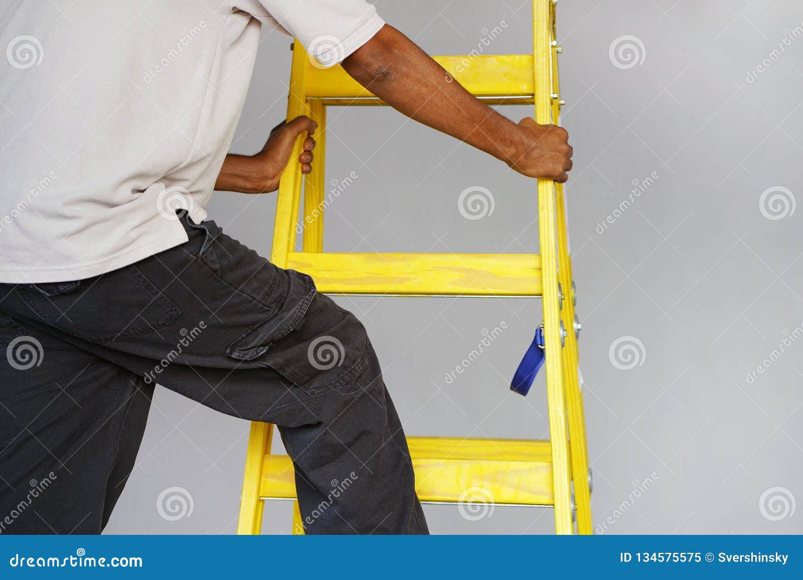 worker with wooden ladder