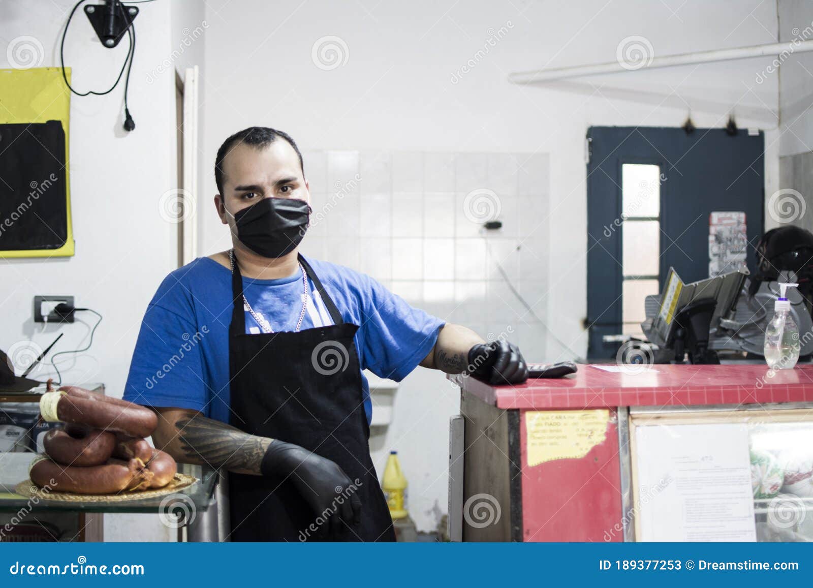 Worker Working in a Deli, Wearing a Black Apron Stock Image Image of