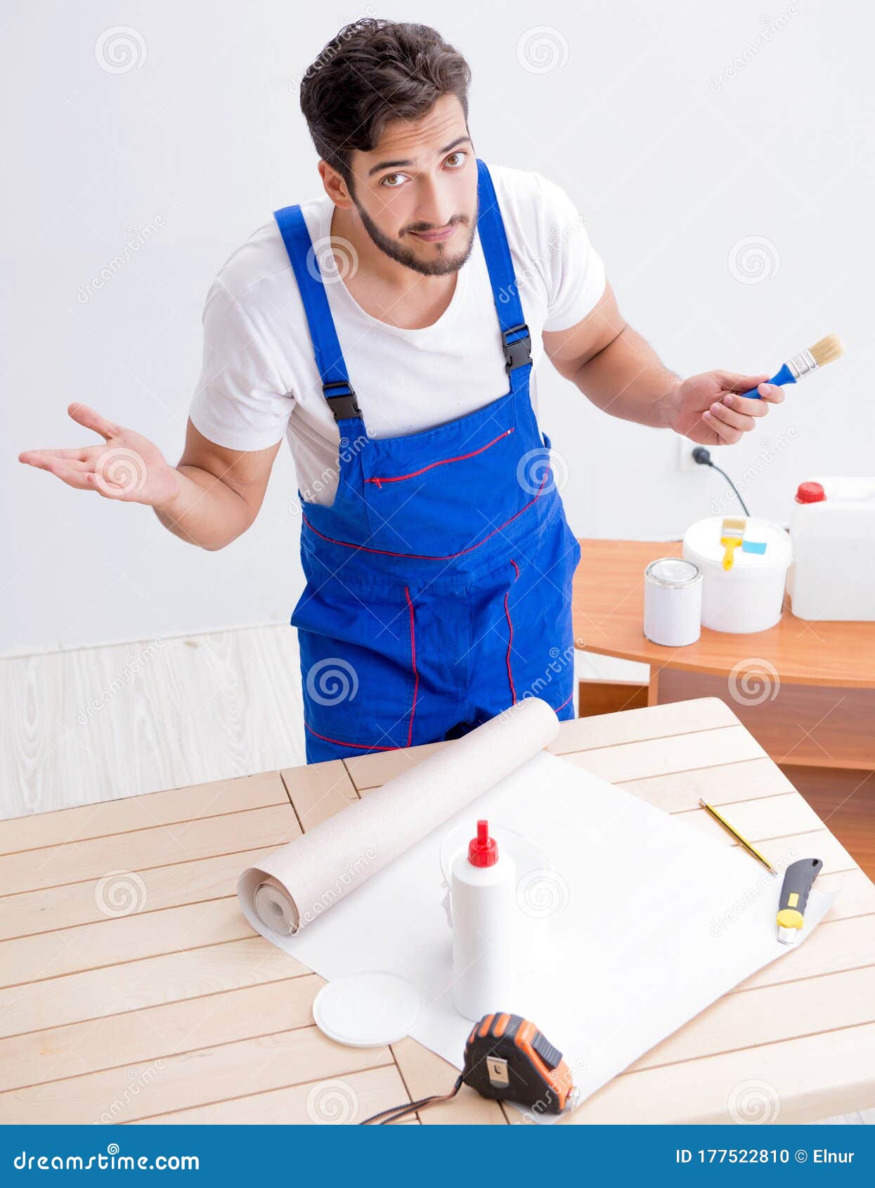 Worker Working on Wallpaper during Refurbishment Stock Photo Image of