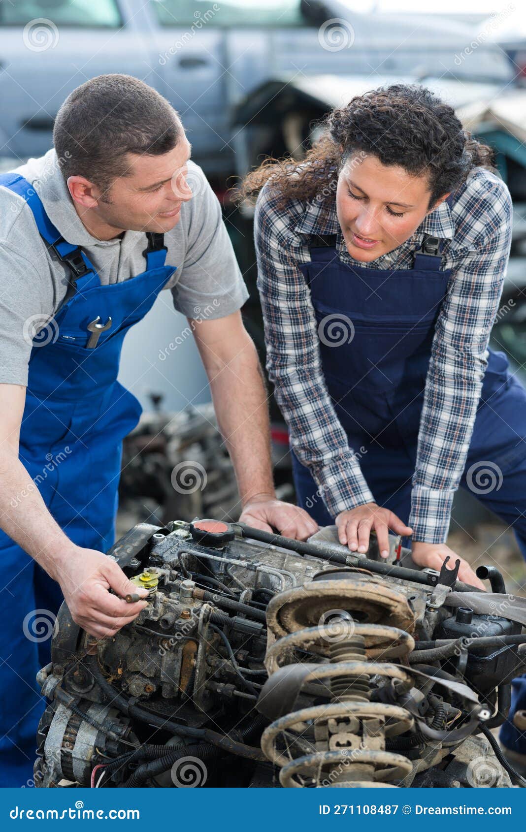 Workers by Dismantled Engine in Scrap Yard Stock Image Image of
