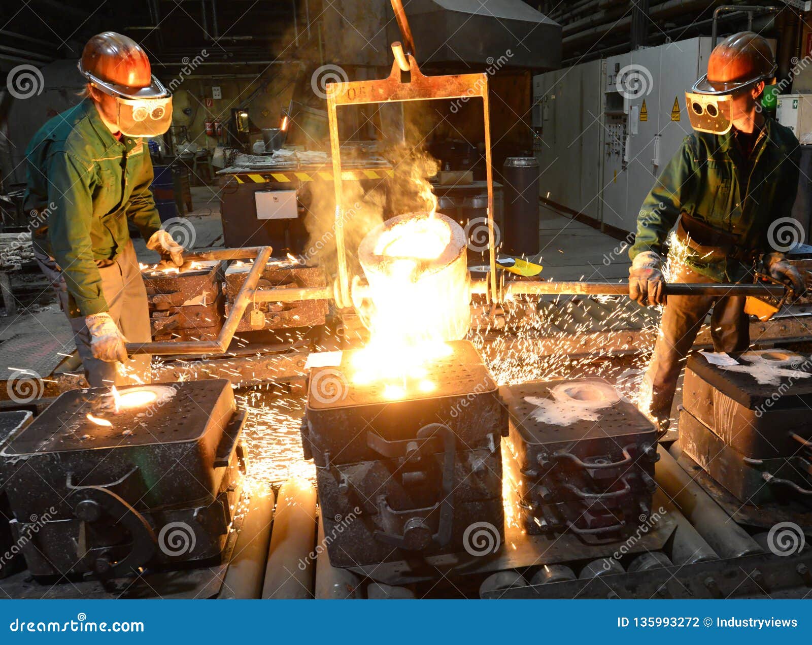 Workers in a Foundry Casting a Metal Workpiece Safety at Work and