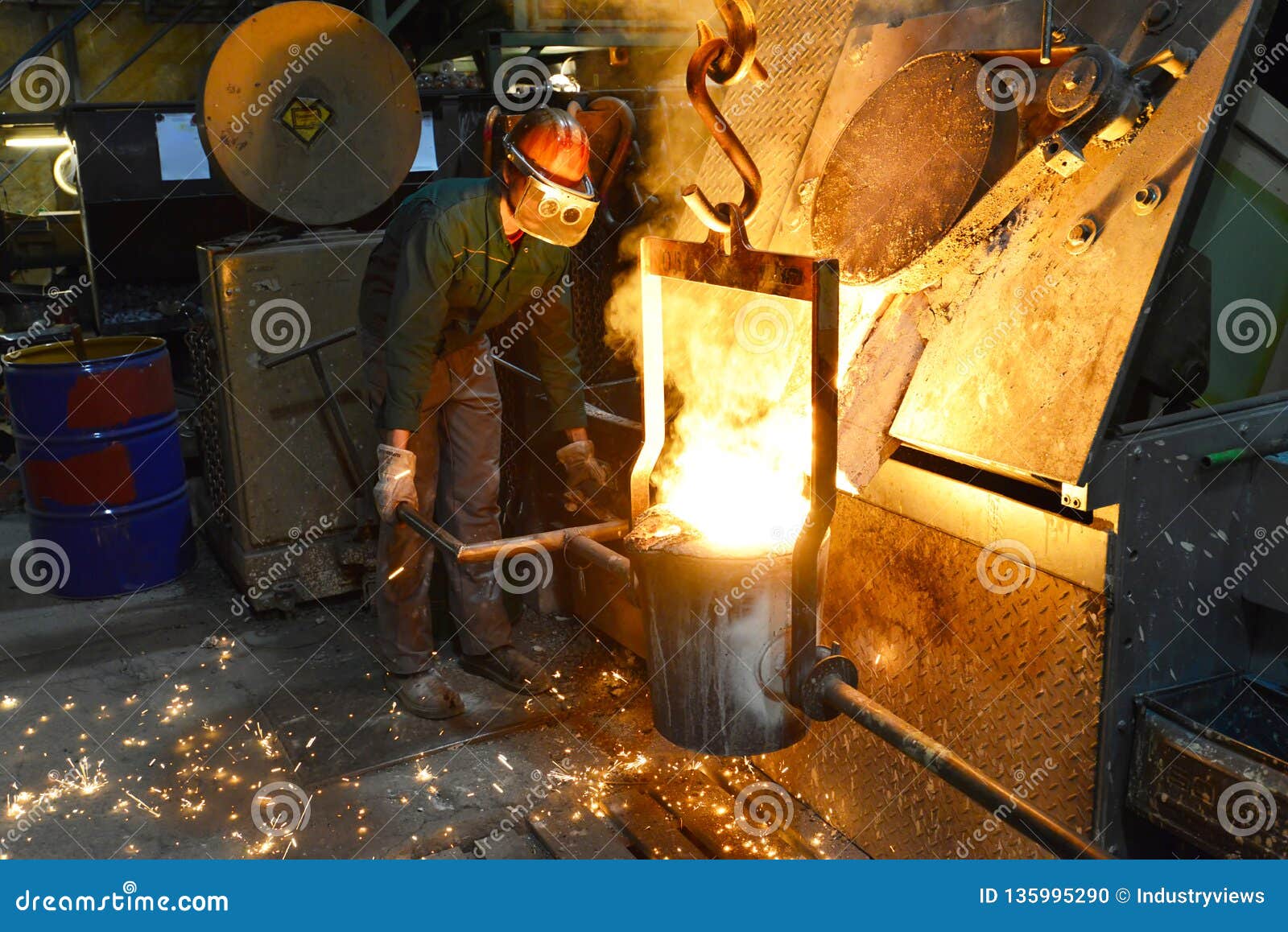 Workers In A Foundry Casting A Metal Workpiece Safety At Work And