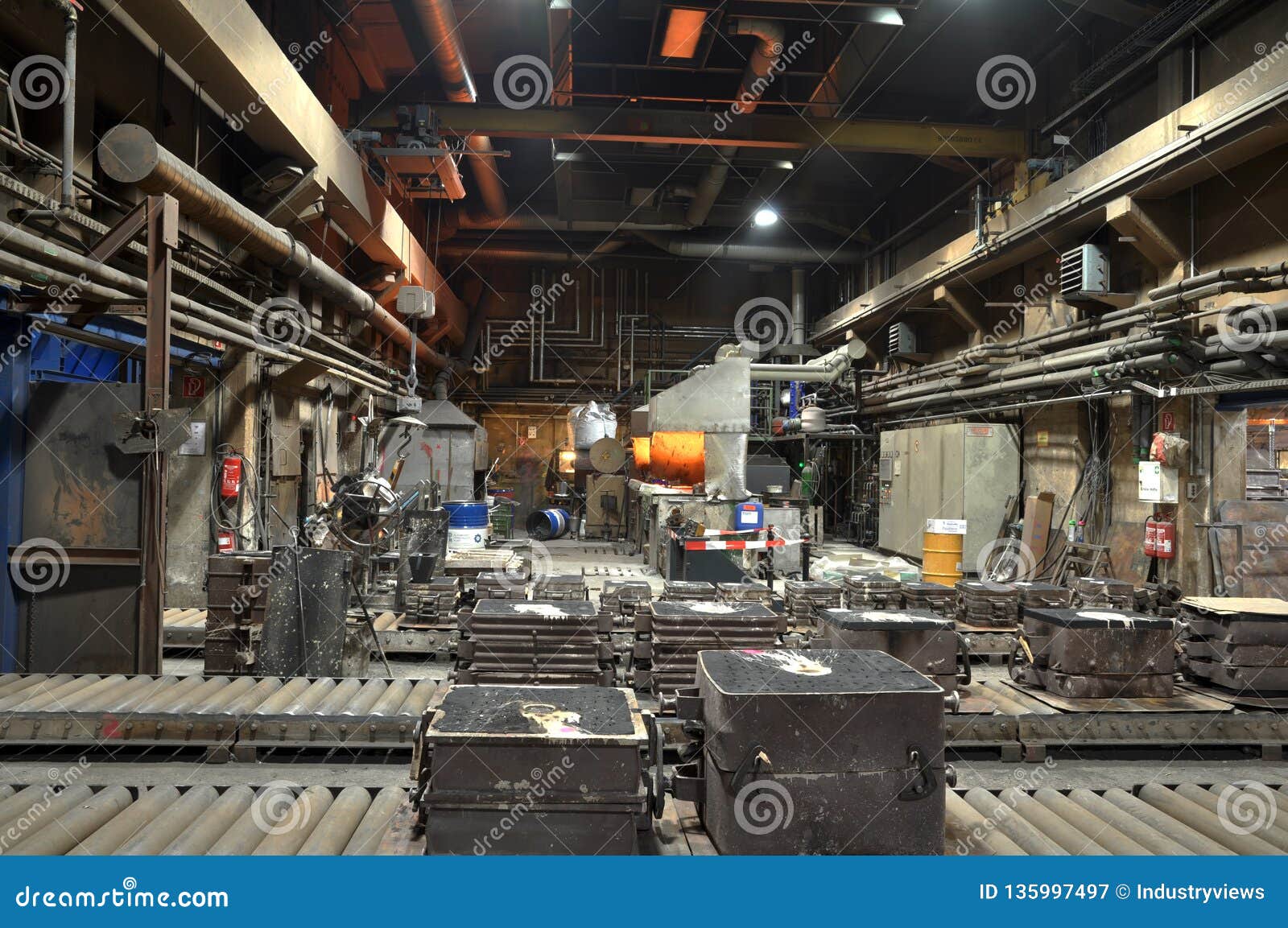 Workers In A Foundry Casting A Metal Workpiece Safety At Work And