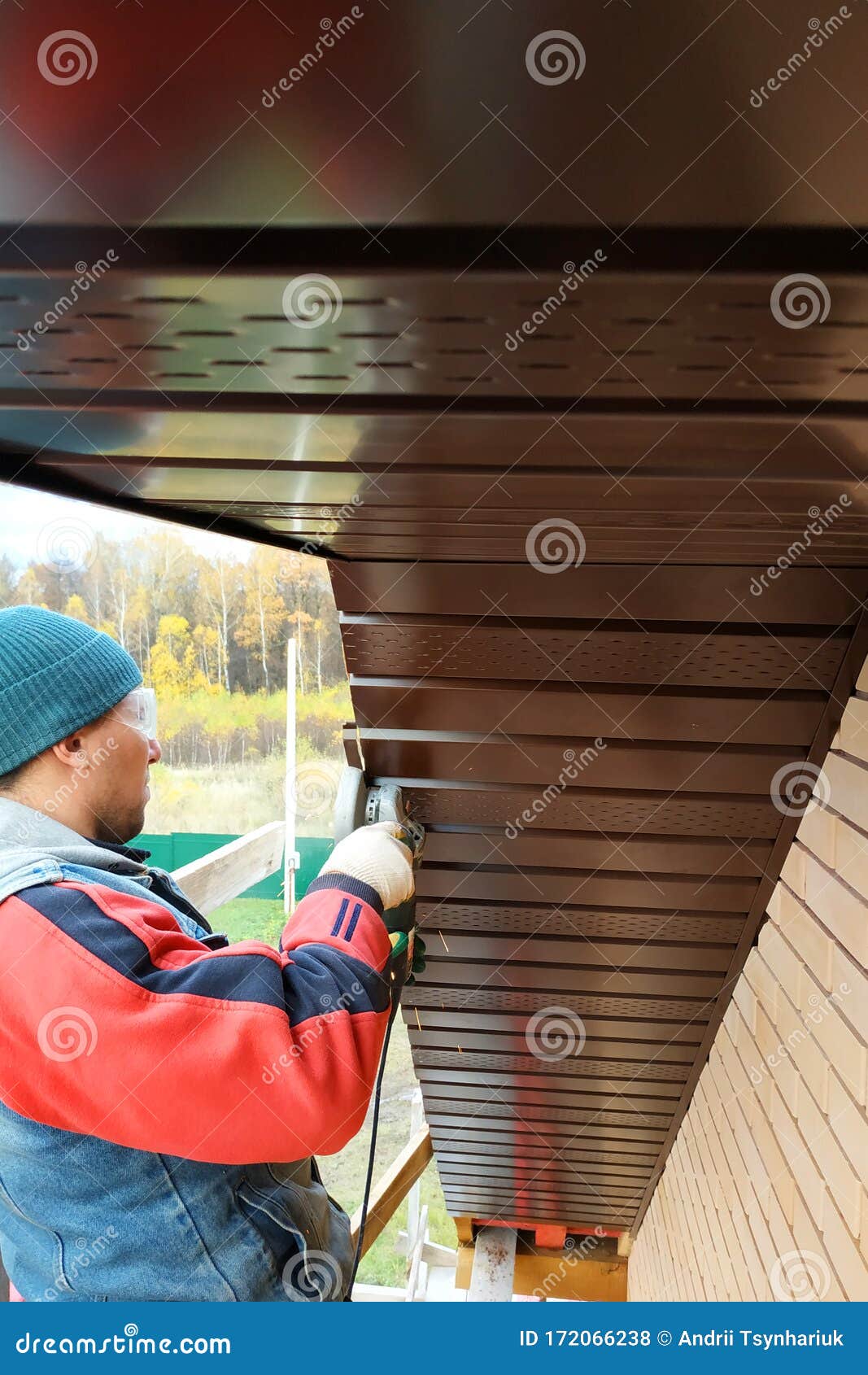 Workers Install Eaves Under the Roof of the House Stock Photo Image