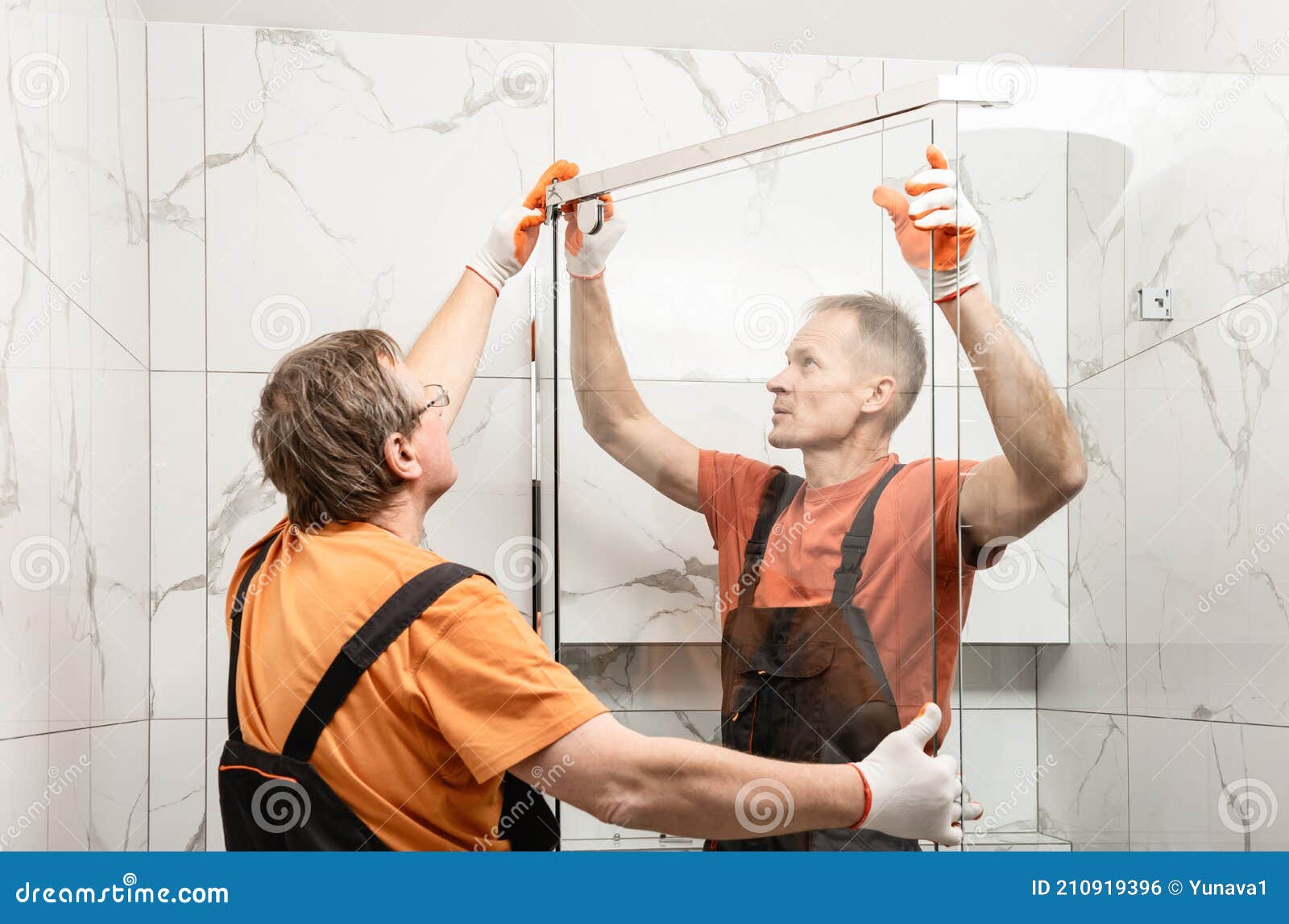Workers are Installing Door of the Shower Enclosure Stock Photo Image