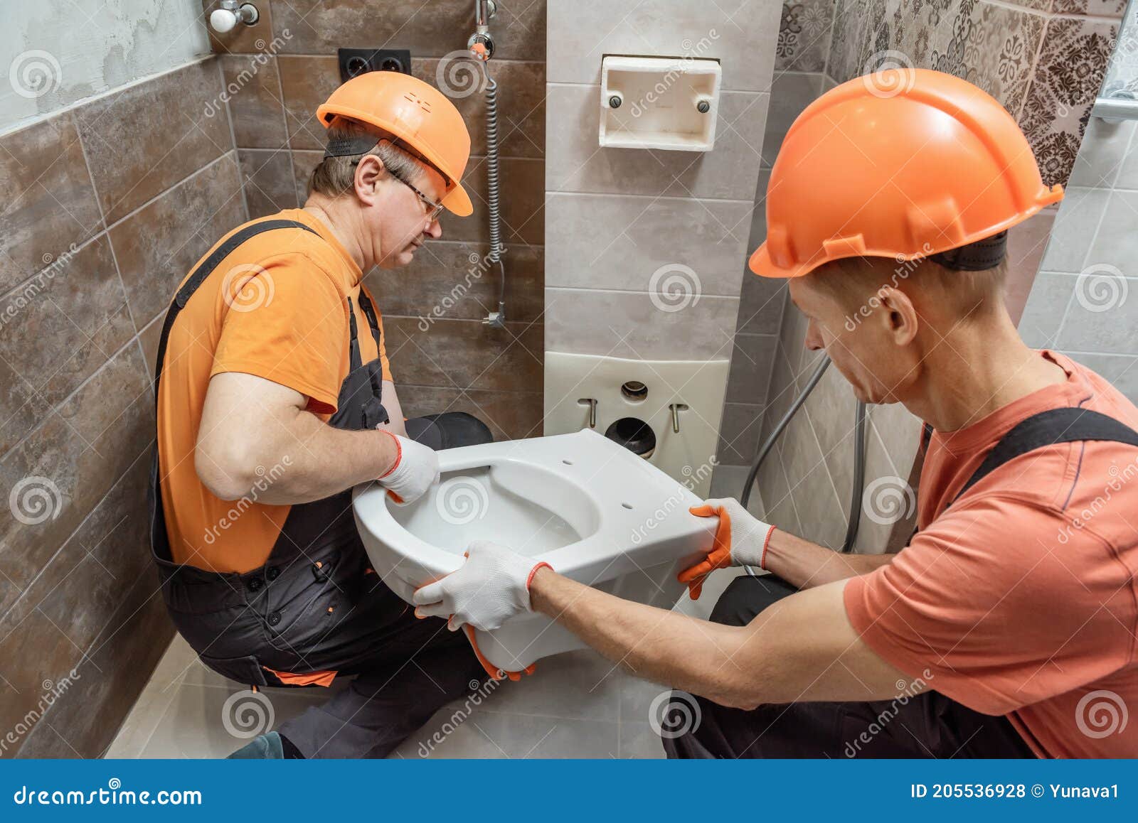 Workers are Installing a Toilet on the Wall Stock Photo Image of