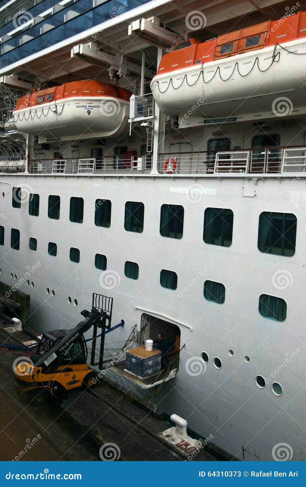 Workers Loading Cargo into Passenger Liner Ship Editorial Stock Photo