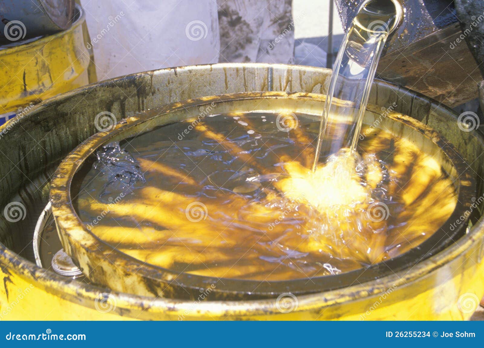Workers Pouring Toxic Wastes into a Metal Drum Stock Photo Image of
