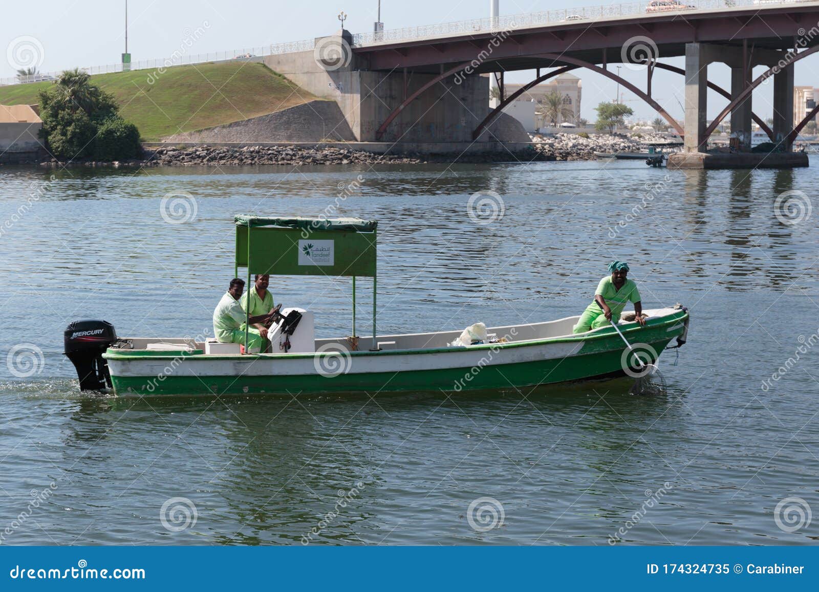 Workers in Uniform on the Boat Cleaning Bay Editorial Image Image of