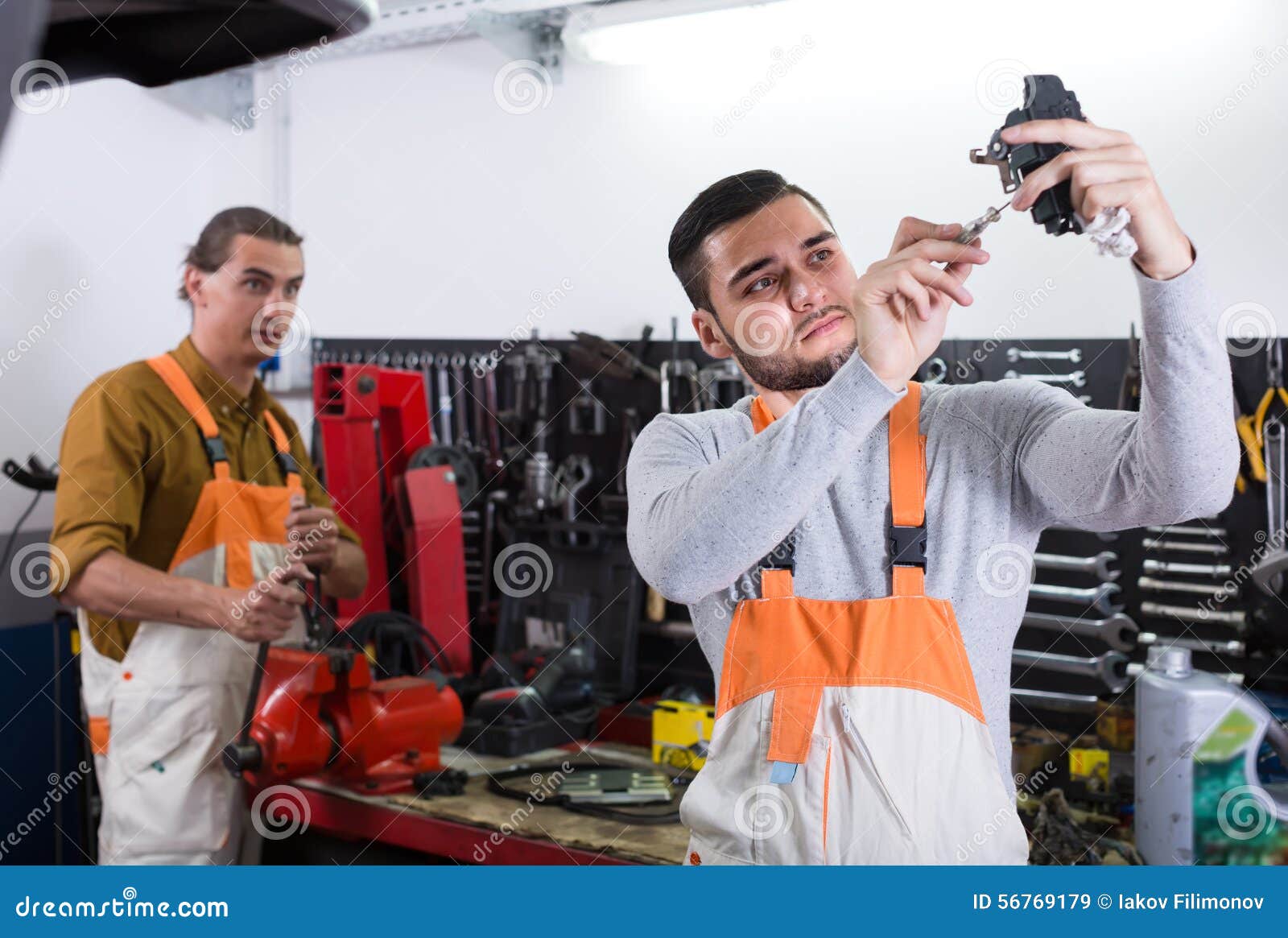 Workers in Uniform at Workshop Stock Image - Image of portrait, male ...