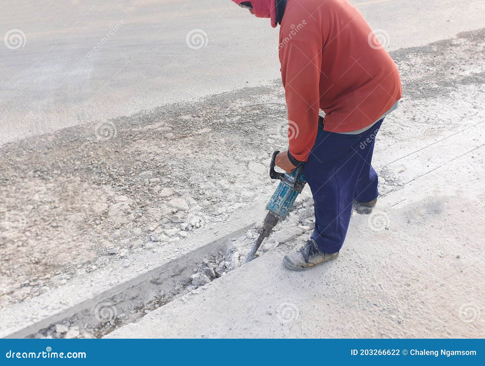Workers Use Demolition Machine Hammer Drilling Cement Floor To Make