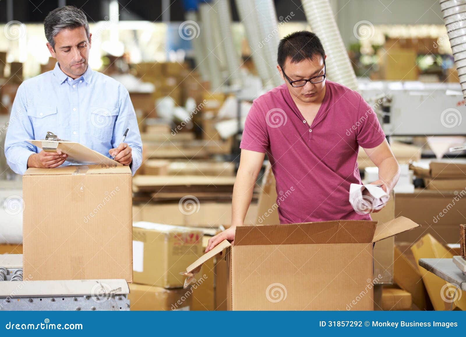 Workers in Warehouse Preparing Goods for Dispatch Stock Photo Image