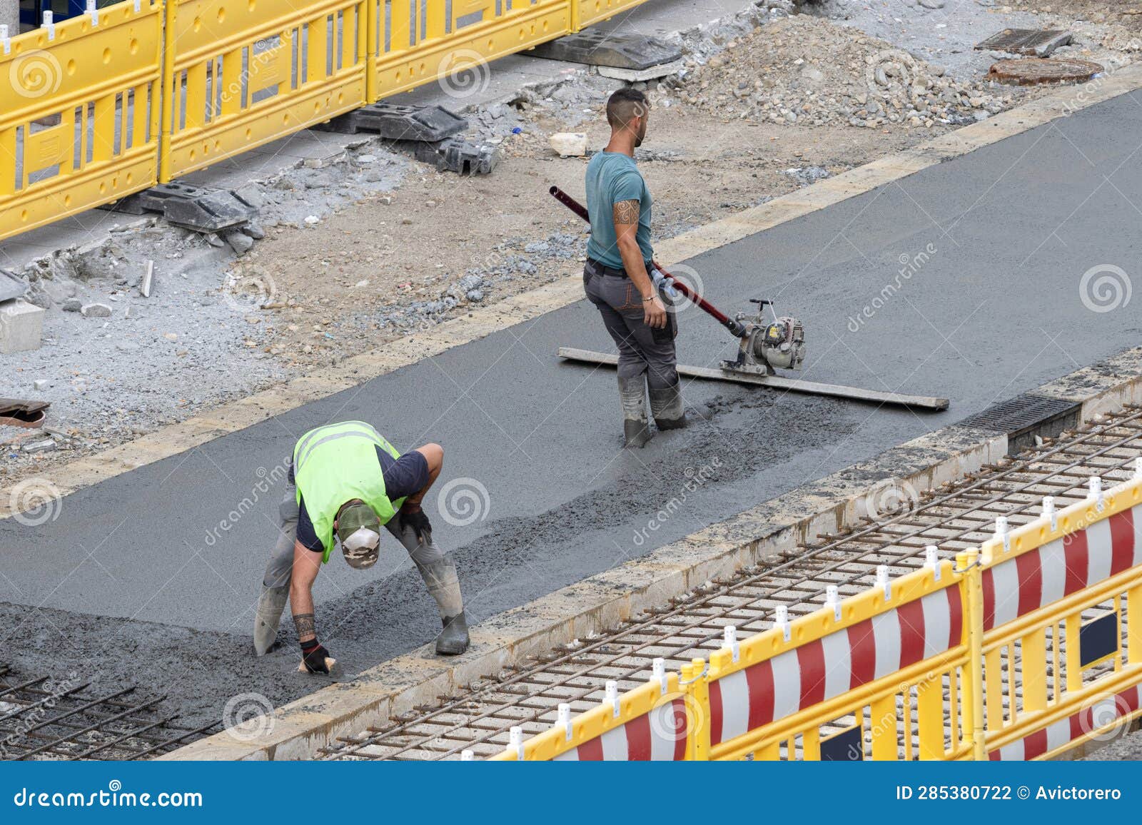 Workers Working on a City Road Polishing Concrete on a Construction