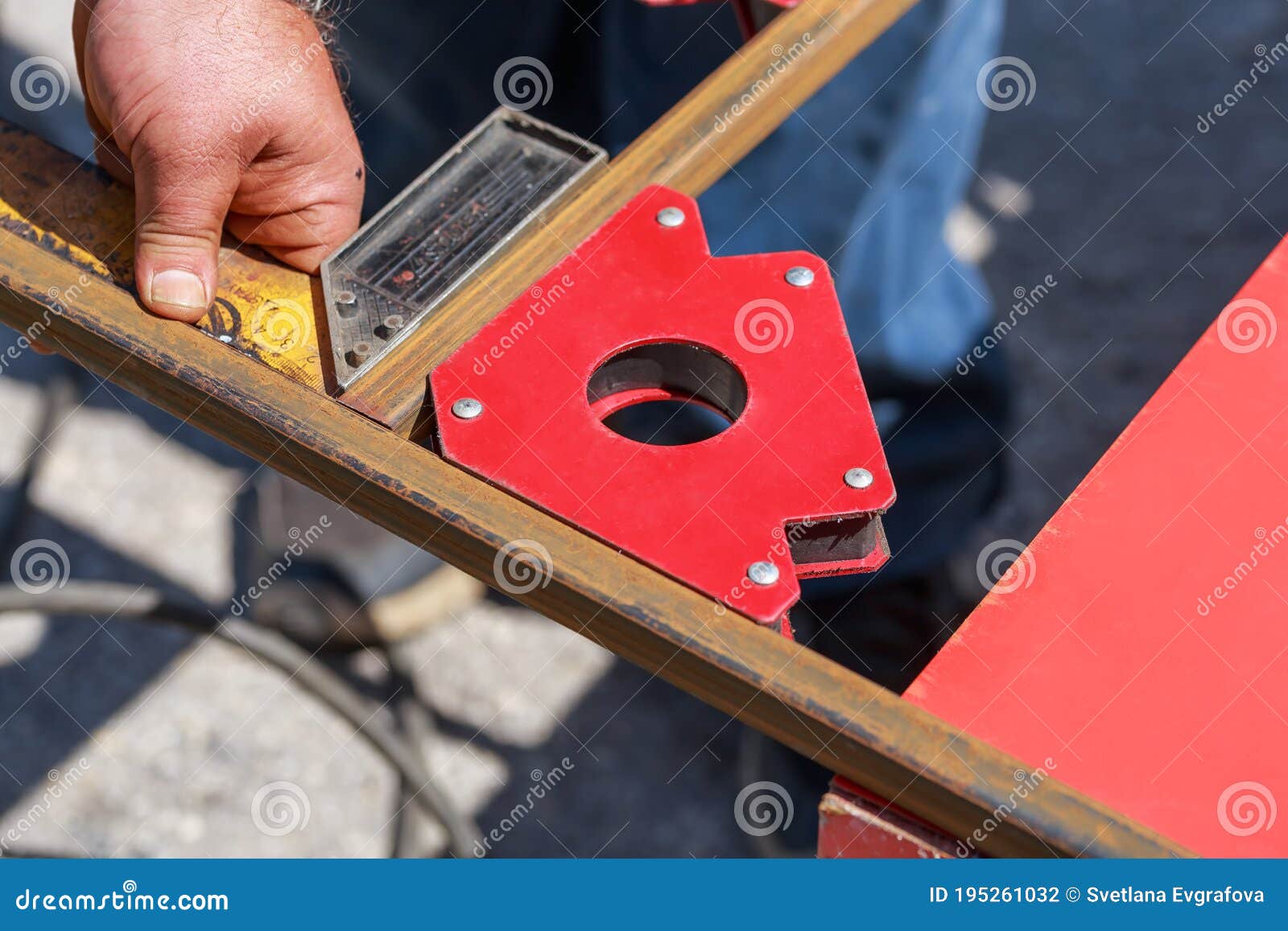 Working Auxiliary Tools in the Hands of a Worker Welder. Using a