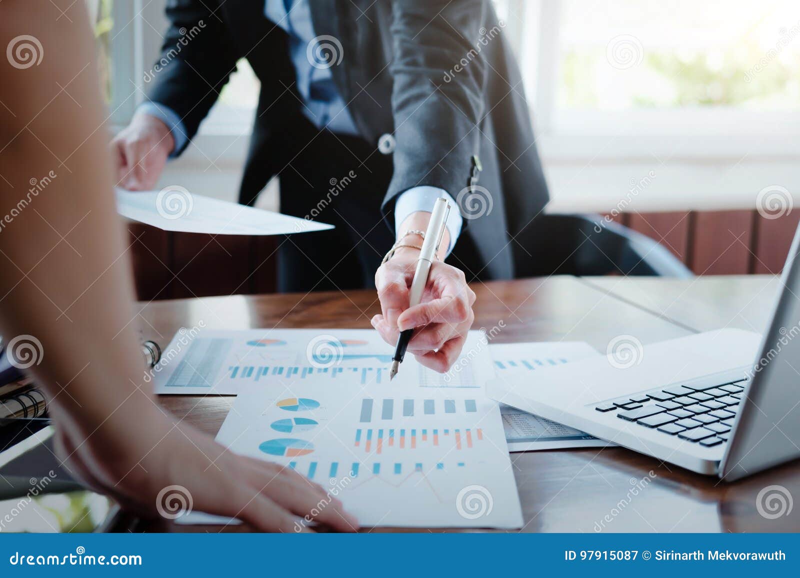 working business people analyse high performance marketing data.