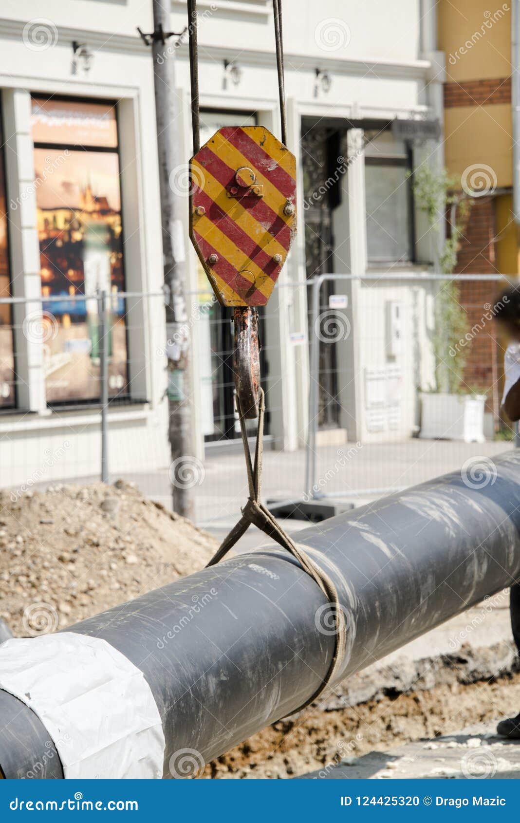 Working with a Crane and Lifting Pipes on the Building Stock Photo