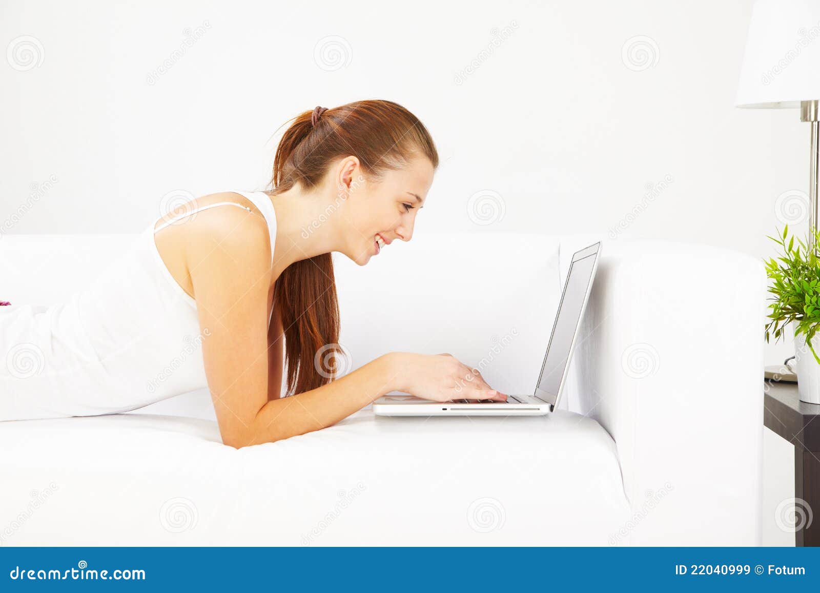 Working on laptop at home stock image. Image of caucasian 22040999