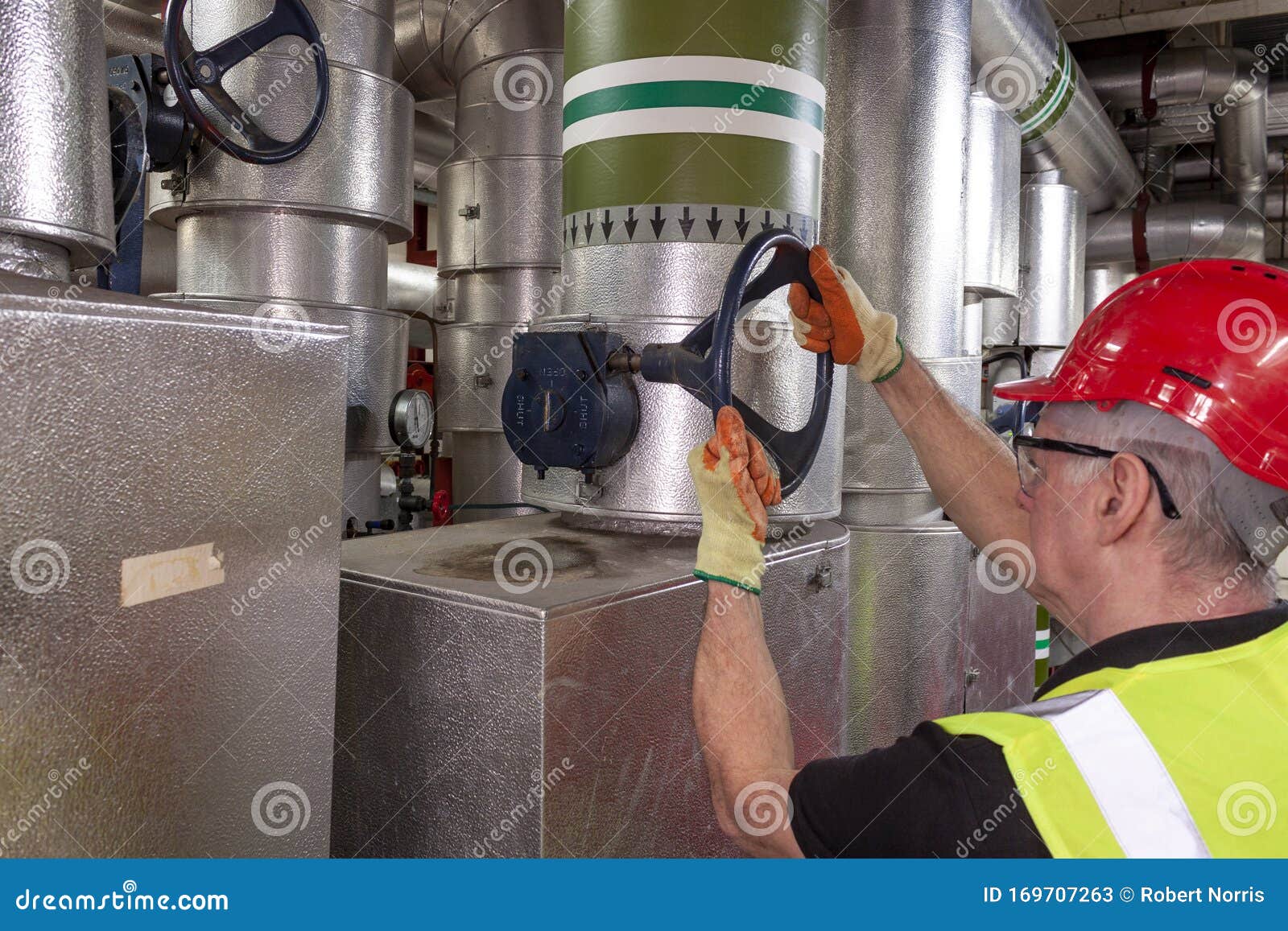 Working Mechanical Engineer in Hard Hat and High Visibility Vest Stock ...