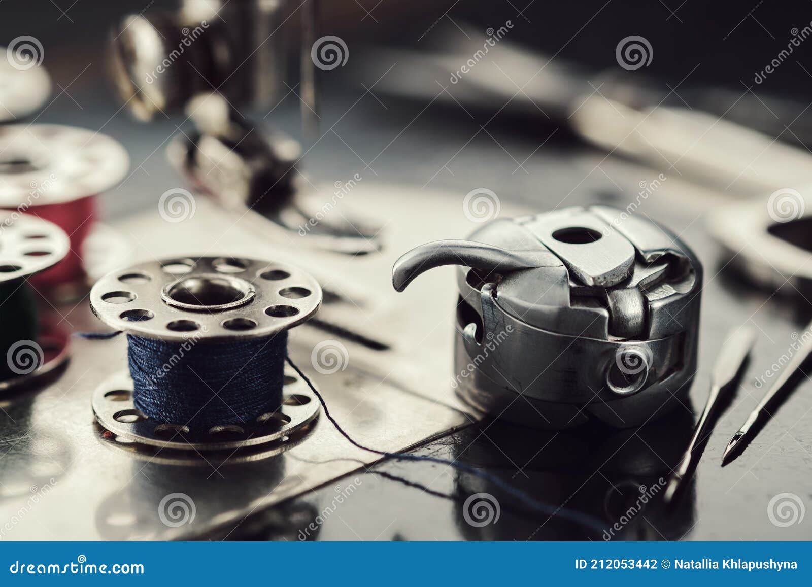 Working Part of Antique Sewing Machine. Selective Focus on Spool of