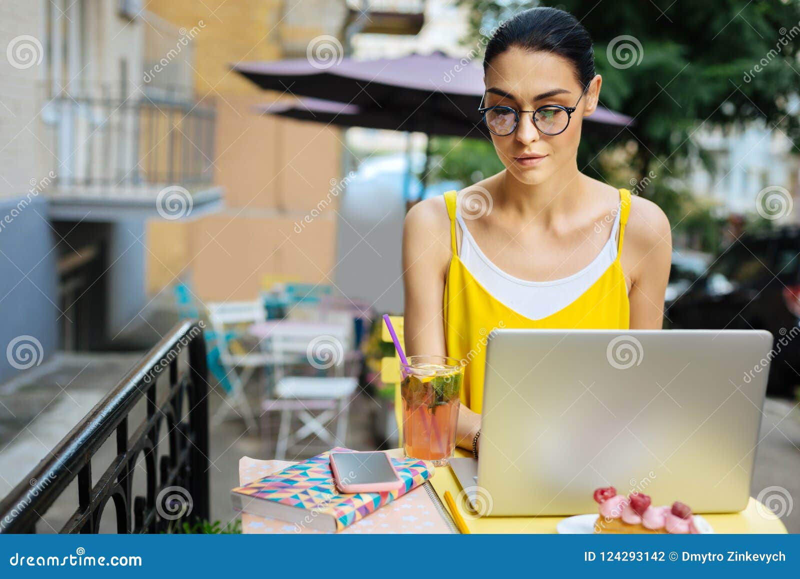 Young Woman Staying Calm while Working on the Laptop Stock Photo ...